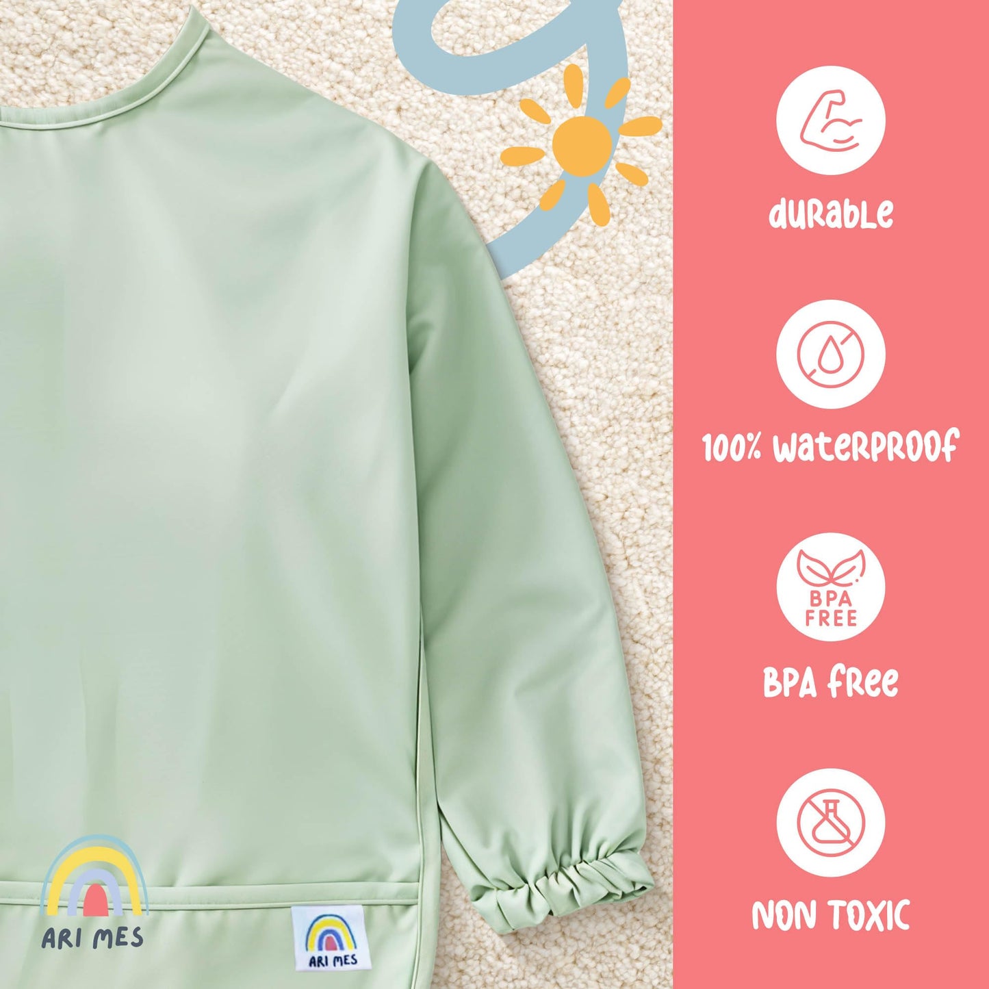 ARI MES dinosaur print baby apron bib laid flat demonstrating full coverage sleeve size
