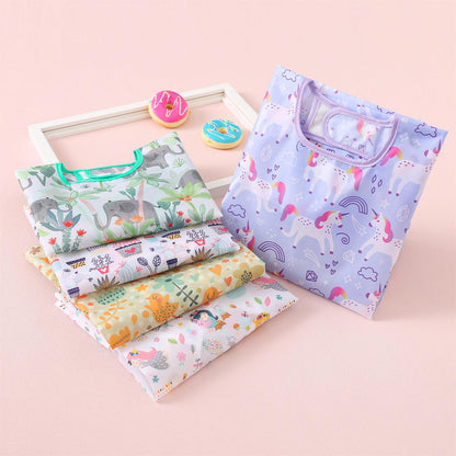 Lightweight waterproof feeding smock bibs laid out to show the complete five piece set assortment.