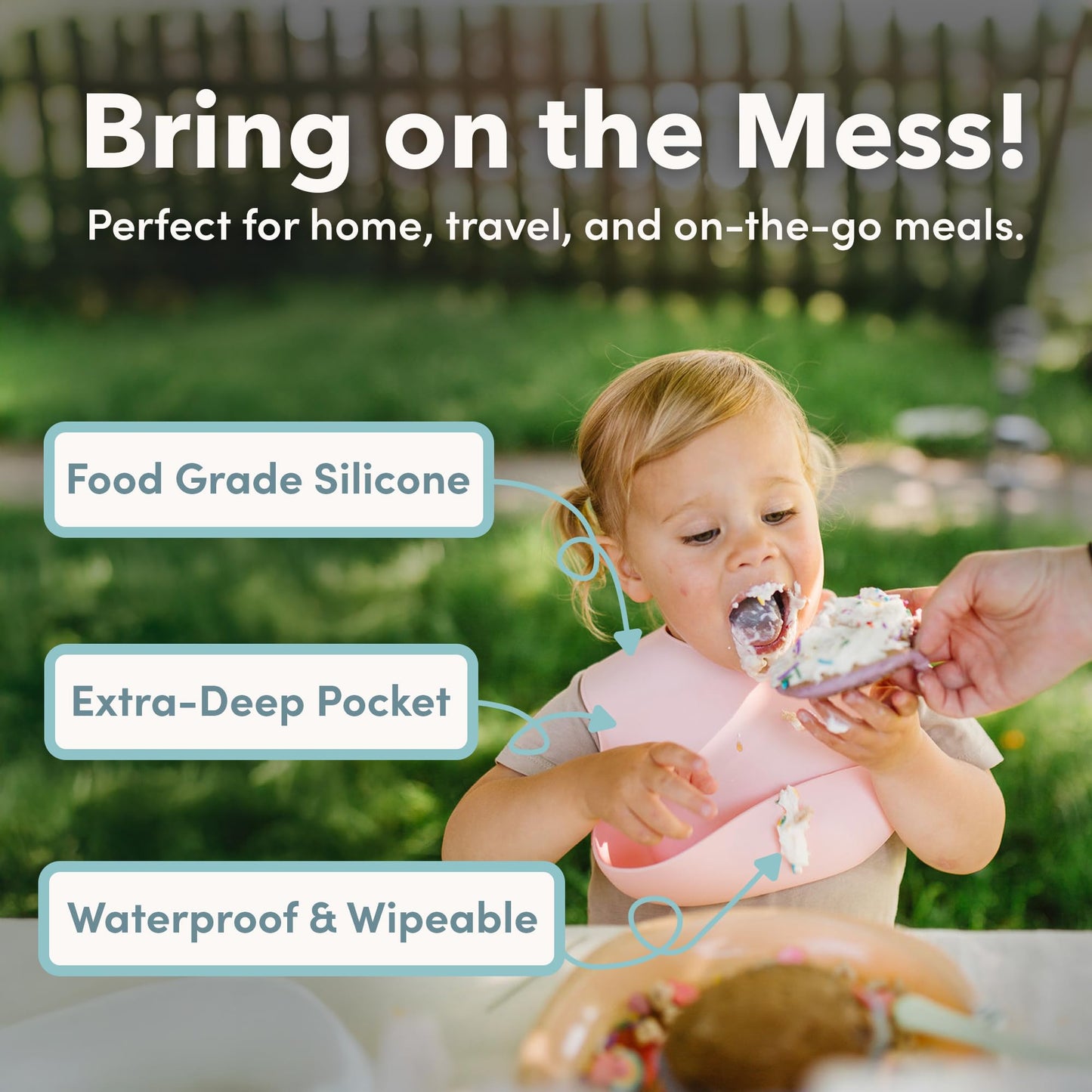 Loulou Lollipop Waterproof Baby Bib showing the deep molded pocket catching food crumbs during mealtime