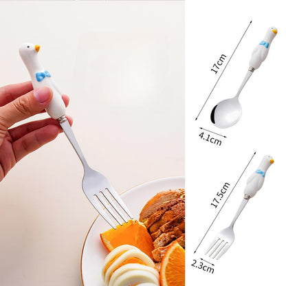 Close up of cartoon ceramic handle detail on stainless steel spoon