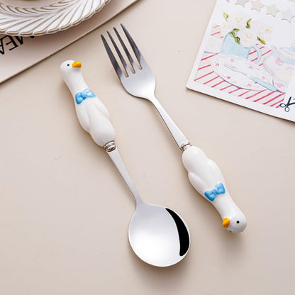 Set of 4 stainless steel dessert spoons with decorative handles