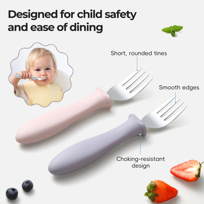 A toddler hand holding the ergonomic food grade baby fork during mealtime.