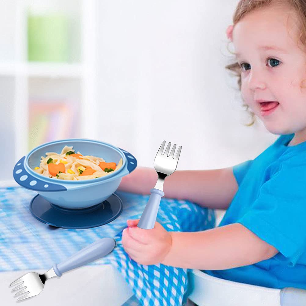 Toddler using Pimoys stainless steel fork for self feeding