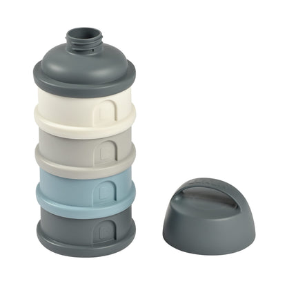Béaba baby milk powder dispenser with the top funnel spout open for precise pouring.