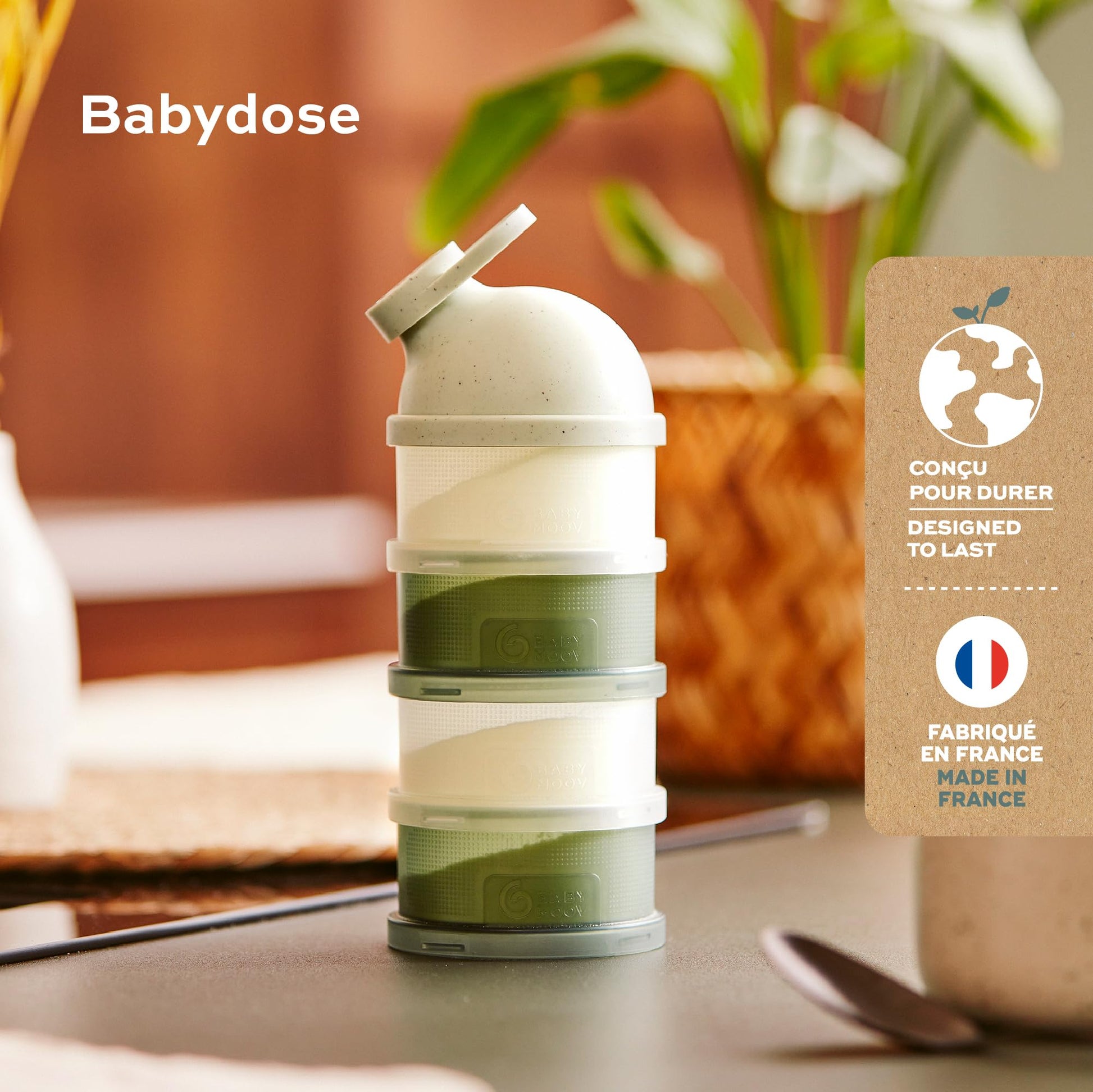 Four stackable compartments detached showing transparent design of the baby milk container