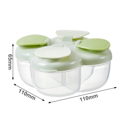 Green multi compartment formula dispenser next to an infant feeding bottle.