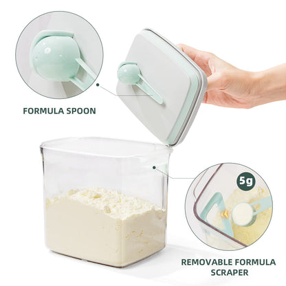 Hygienic scoop holder inside the Tourdeus clear formula dispenser showing clean storage design