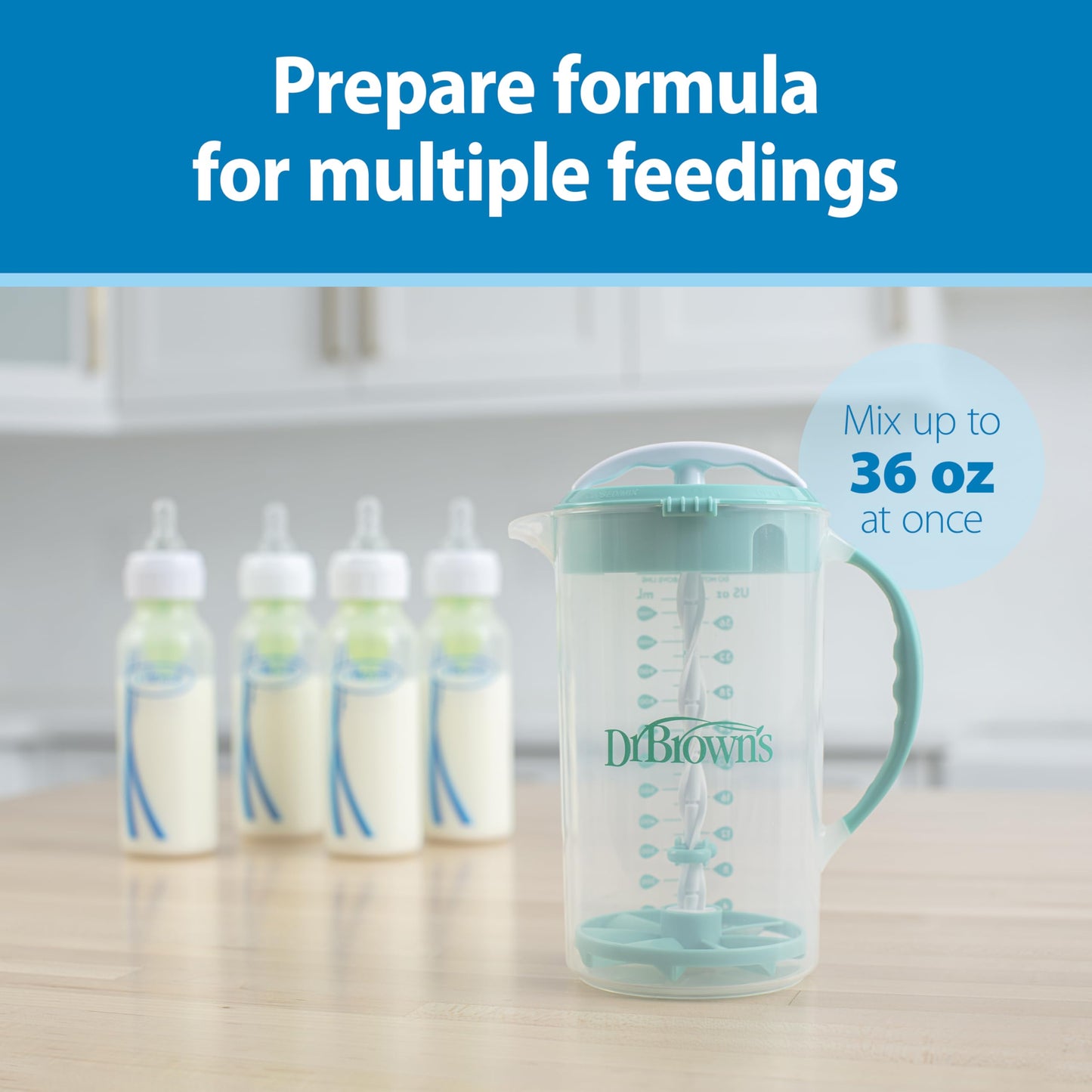 Gray Dr. Brown's baby pitcher with locked lid preventing leaks during formula preparation.