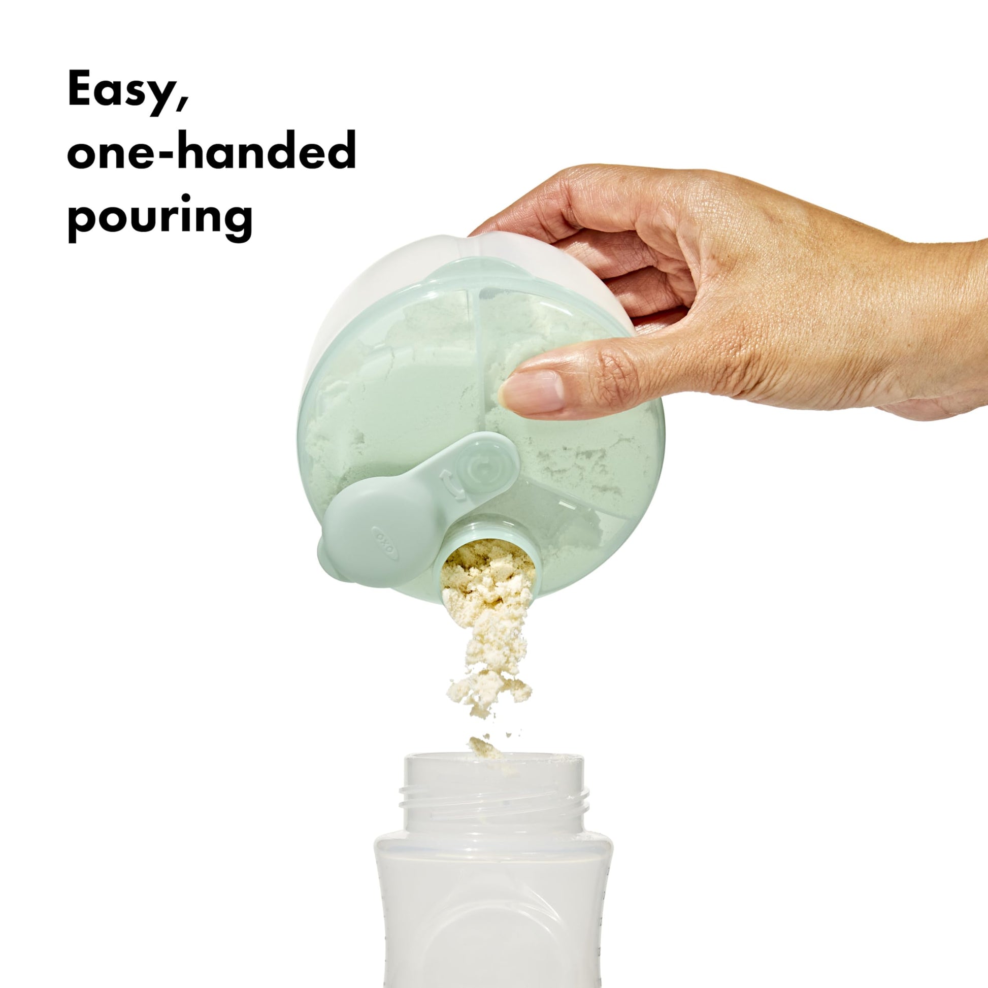OXO Tot three compartment milk powder container showing the swivel cap mechanism.