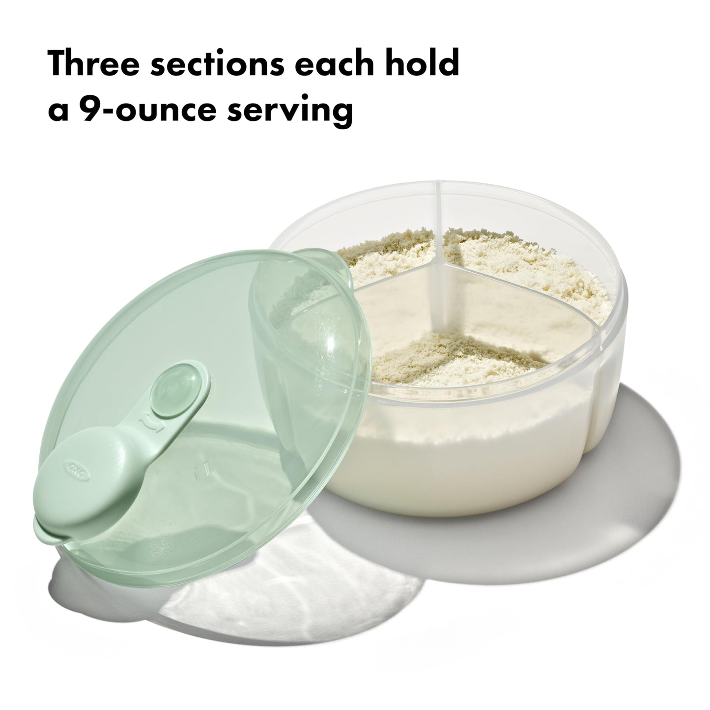 OXO Tot Opal formula container being poured one-handed into an infant bottle.
