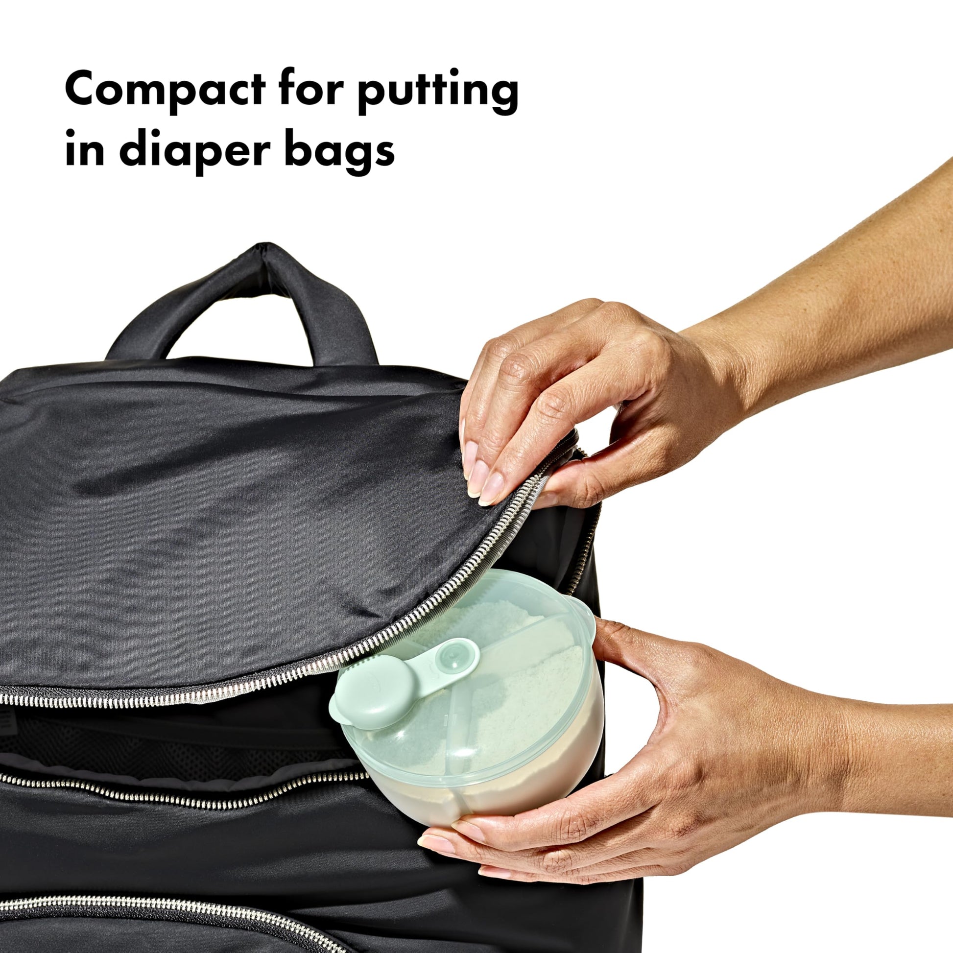 OXO Tot travel snack cup showing the clear body and rounded interior corners.