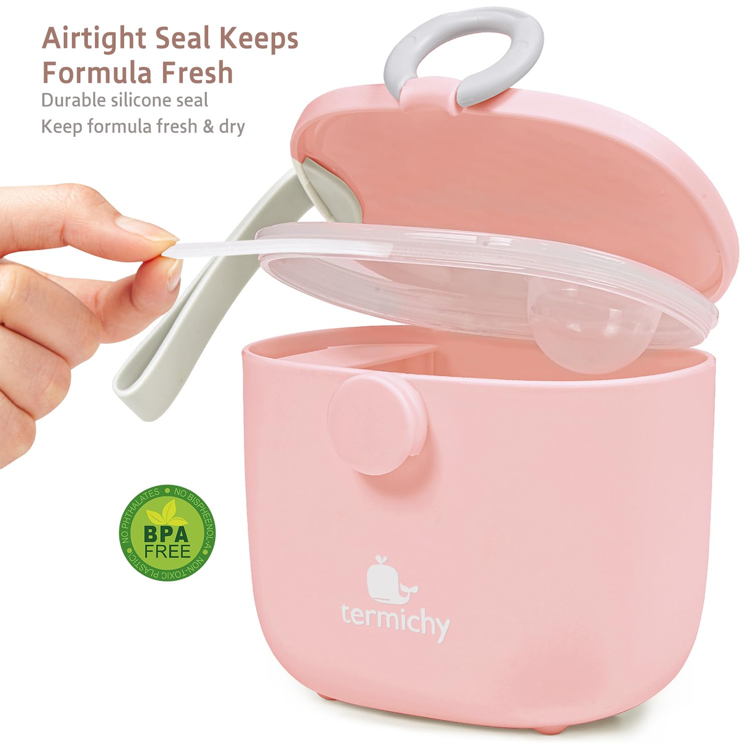 Pink Termichy milk powder dispenser being carried by its integrated handle