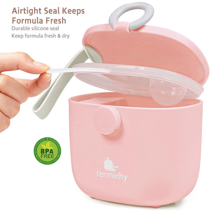 Pink Termichy milk powder dispenser being carried by its integrated handle