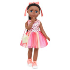 Sparkling pink and peachy sunset hue doll dress displayed on packaging
