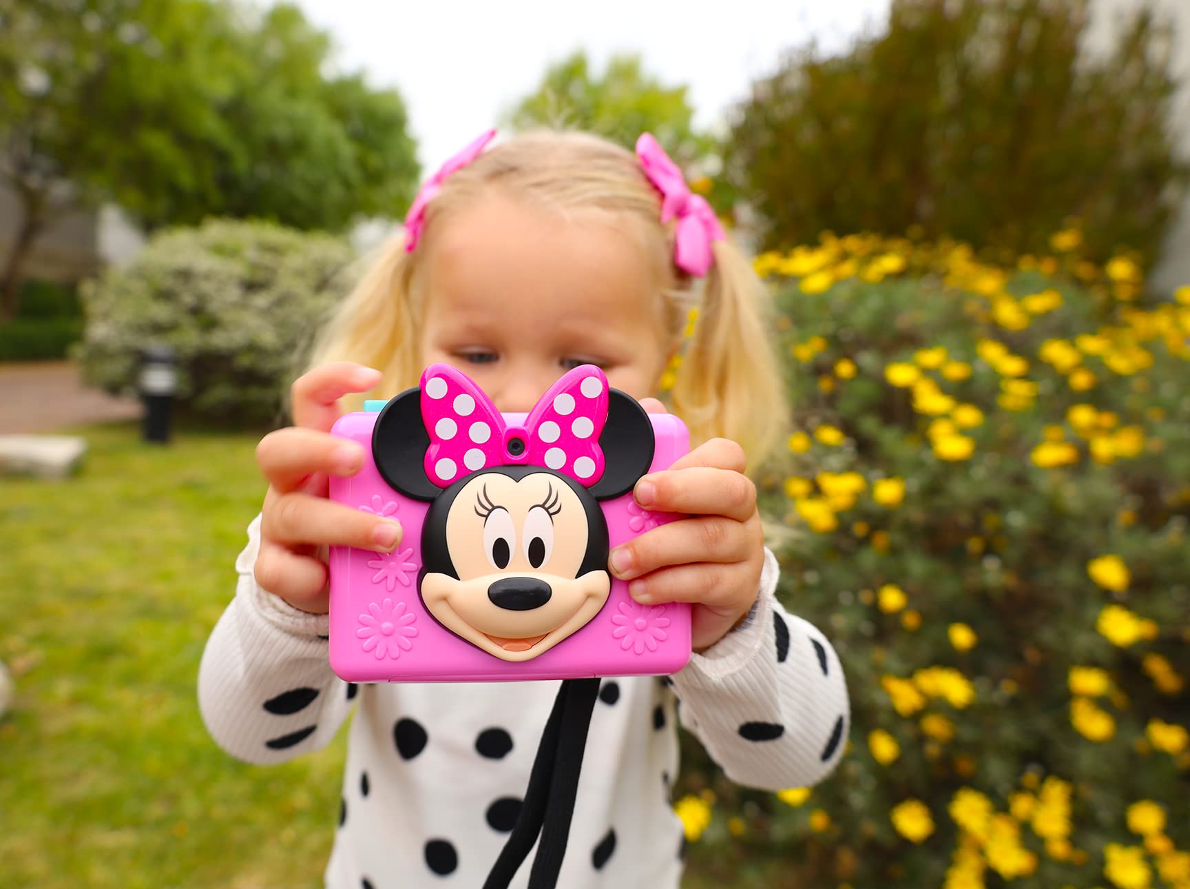 Close-up of the user interface on the eKids Minnie Mouse camera demonstrating the built-in photo frames.