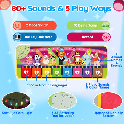 Toddler playing on the Momuse interactive piano mat floor toy.
