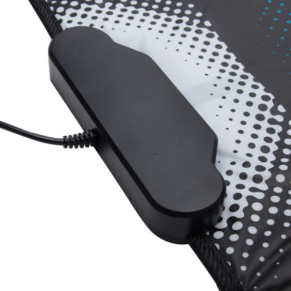 User playing dance game on PC with USB mat