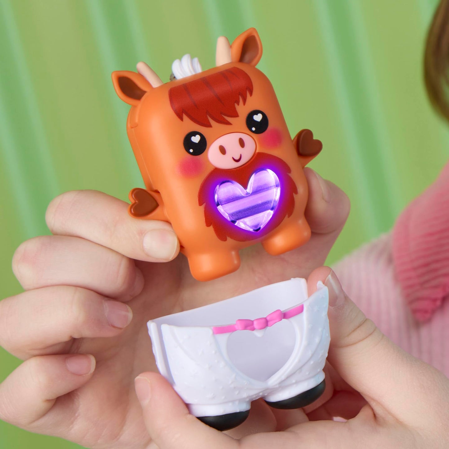 Cowbert the electronic pet cow being shaken to demonstrate the movement sensor functionality