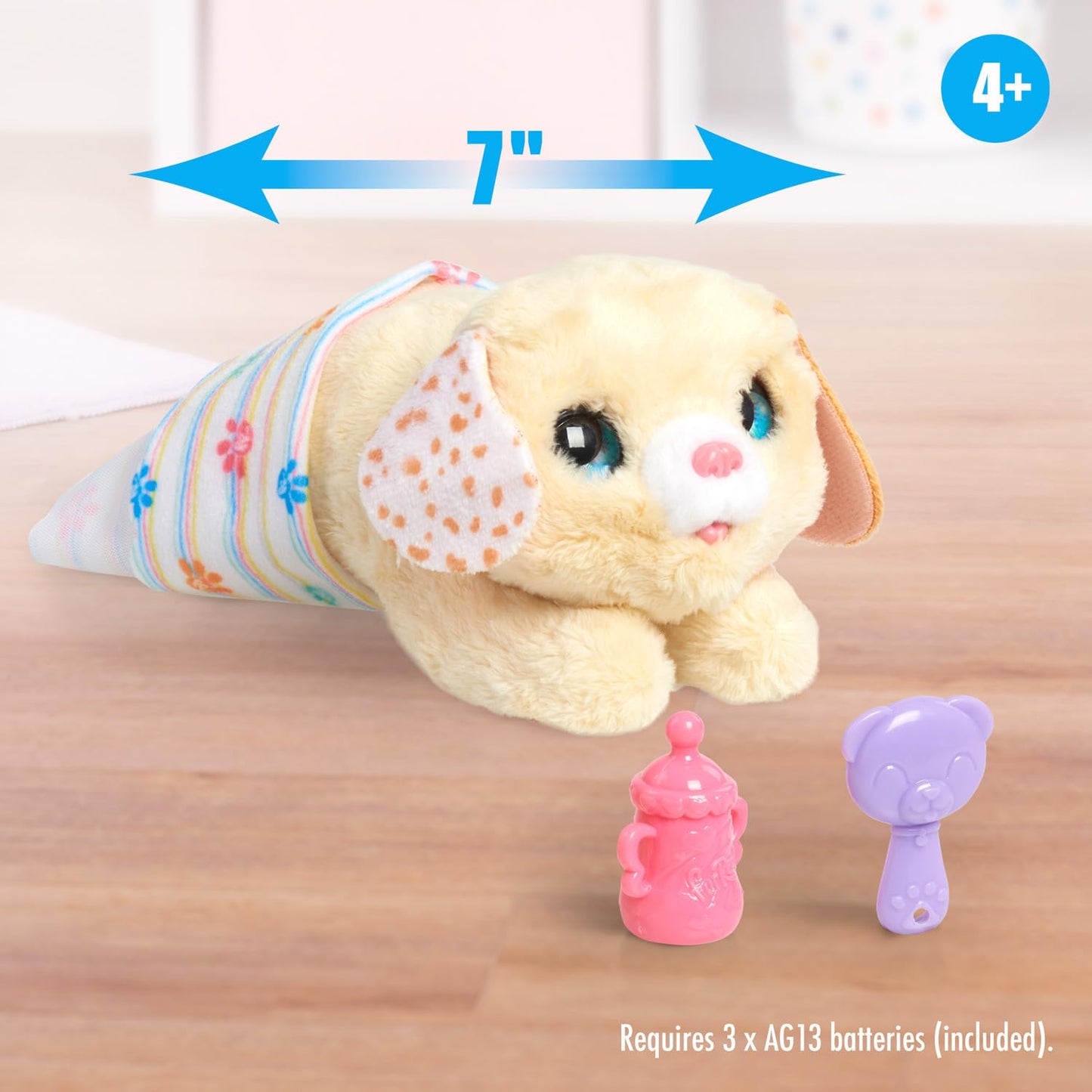 FurReal Newborns interactive dog toy being fed with the included miniature bottle accessory.