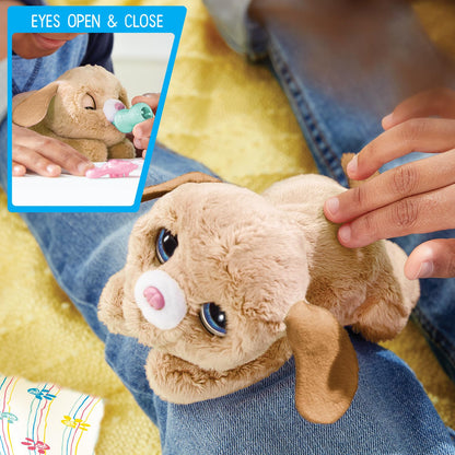 Six inch animatronic puppy toy standing next to its blanket, brush, and feeding bottle accessories.
