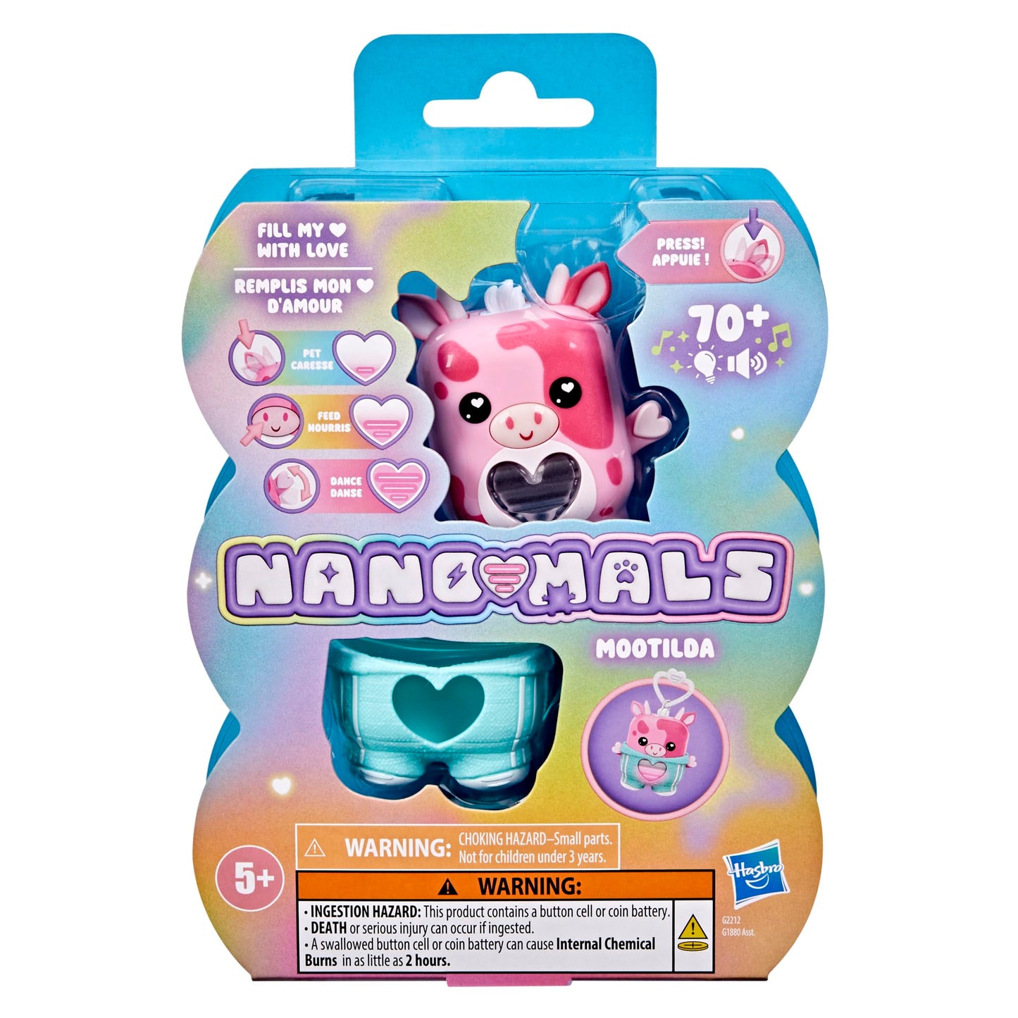 Interactive pink strawberry cow fidget toy being held to show pocket sized dimensions
