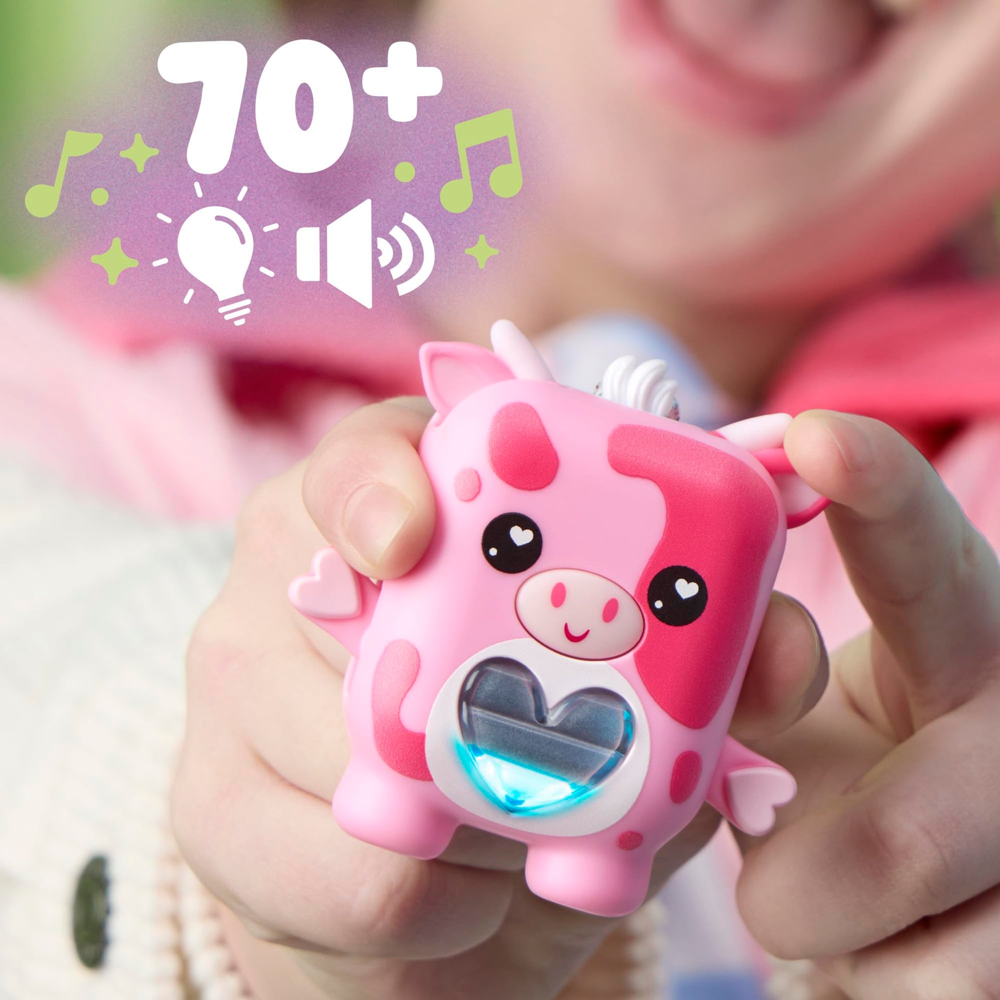 Pocket size electronic cow toy with backpack clip attachment for mobile travel play