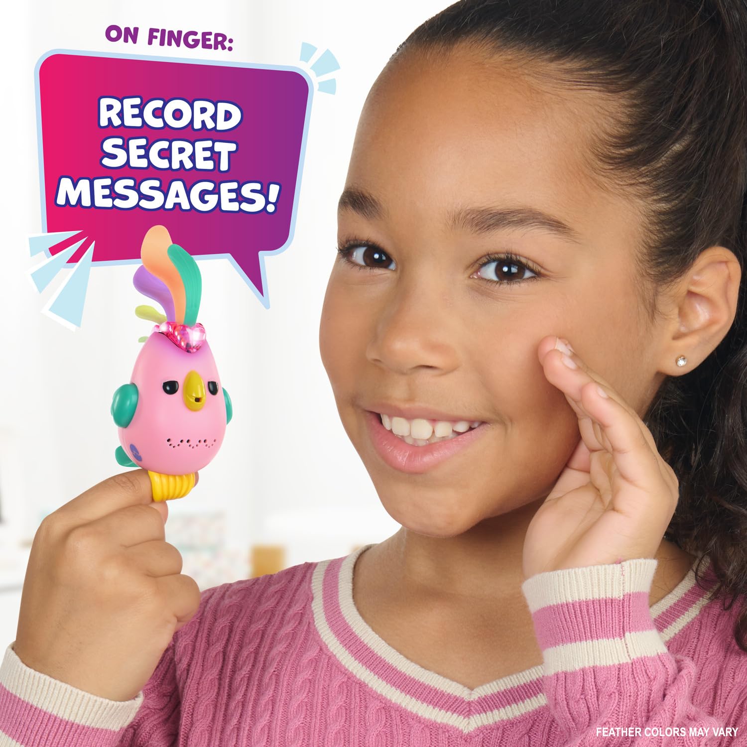Pink interactive toy bird perched on a finger with a glowing heart indicator