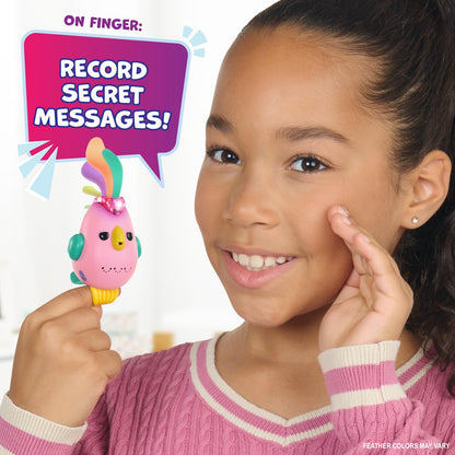 Pink interactive toy bird perched on a finger with a glowing heart indicator