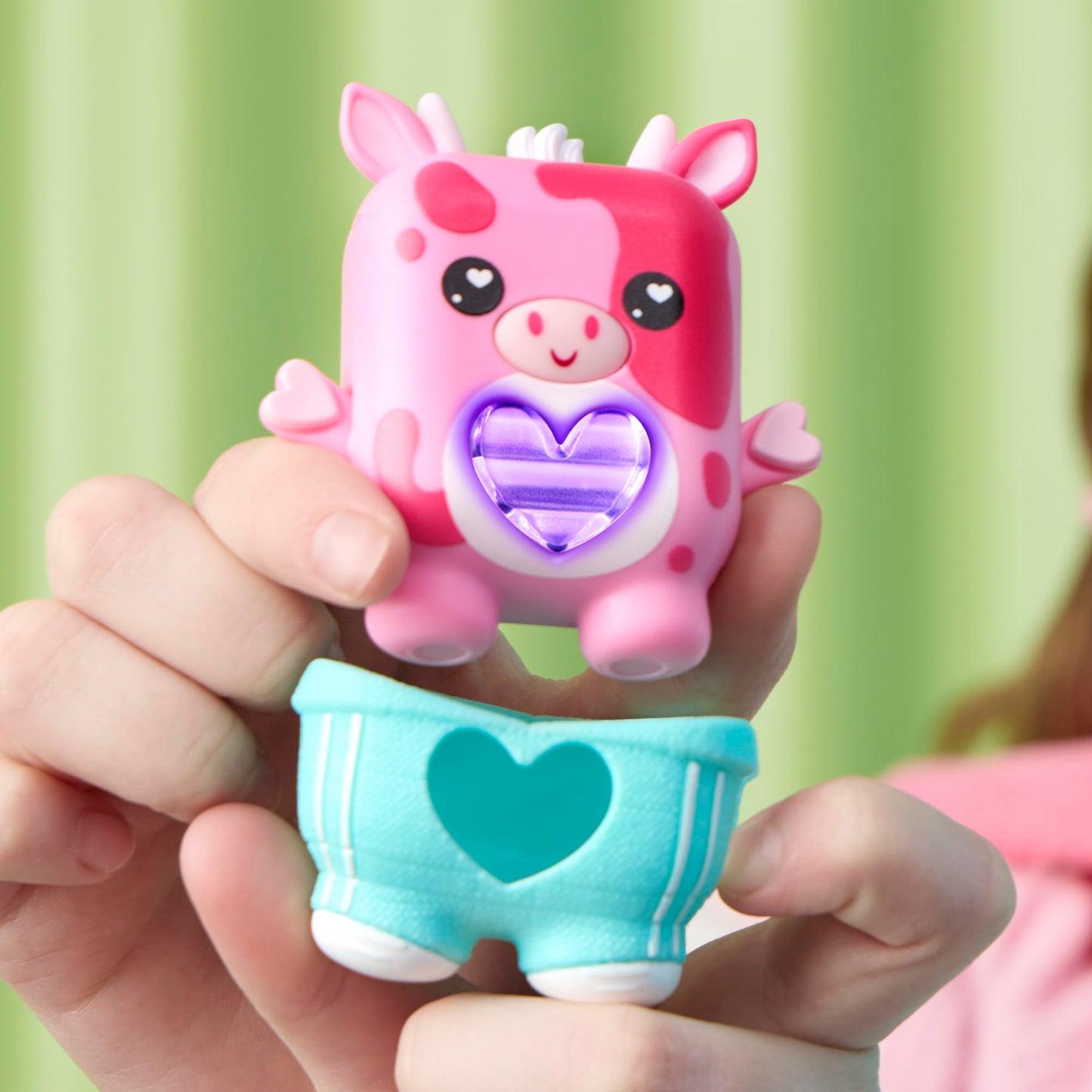 Two interactive electronic pet toys side by side demonstrating the social chatter feature