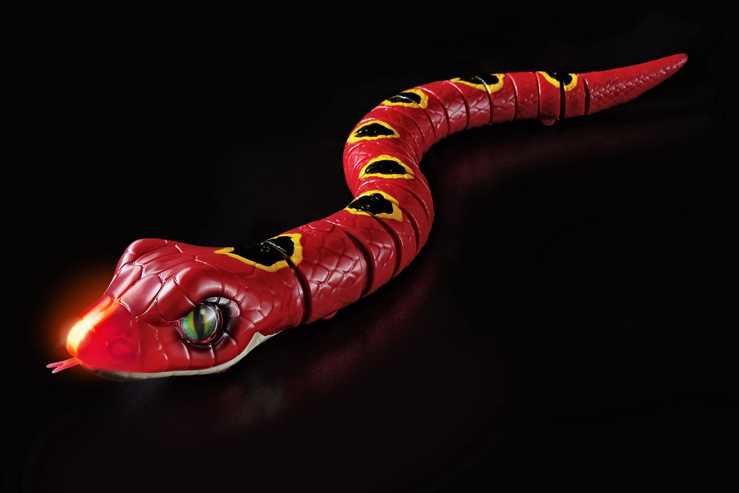 Side profile of the battery powered slithering snake toy showing the realistic moving eyeball details