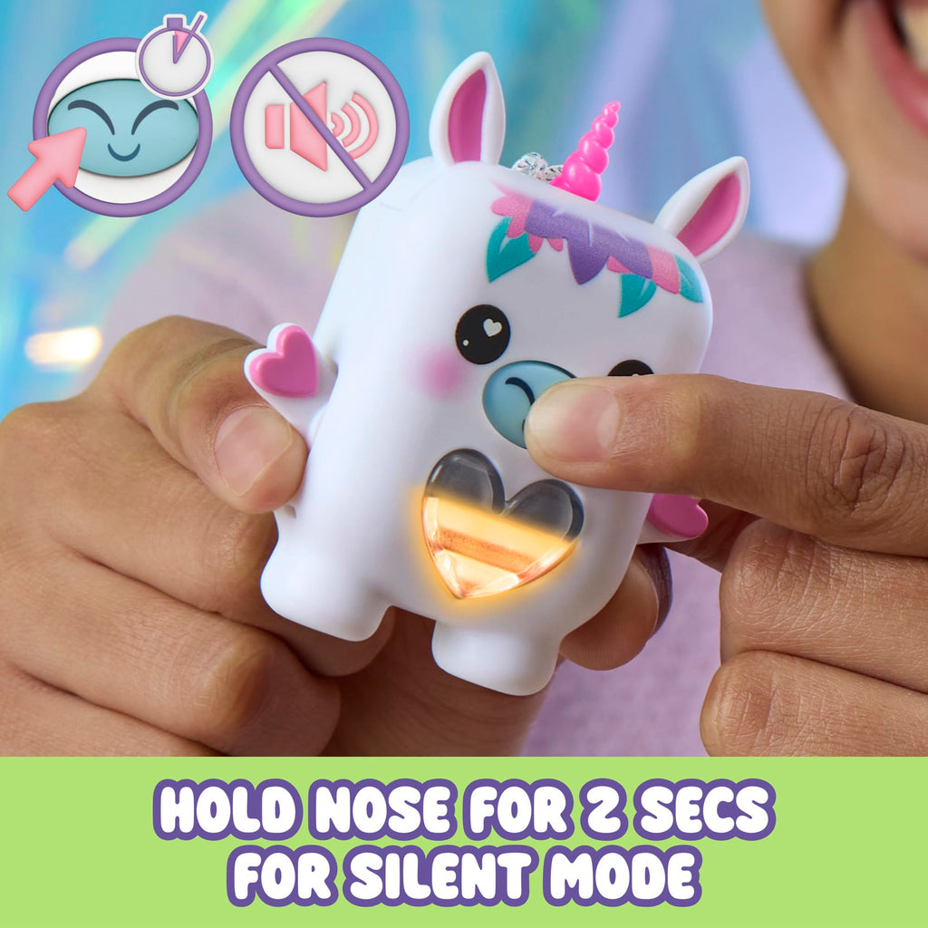 Side profile of the white electronic unicorn toy showcasing the removable sensory dress accessory and arm joints