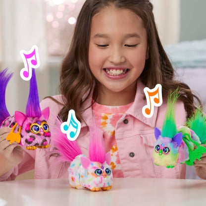 Furby DJ Furblets Berry-Cup-Cake mini plush with its removable keychain clip attached to a child backpack
