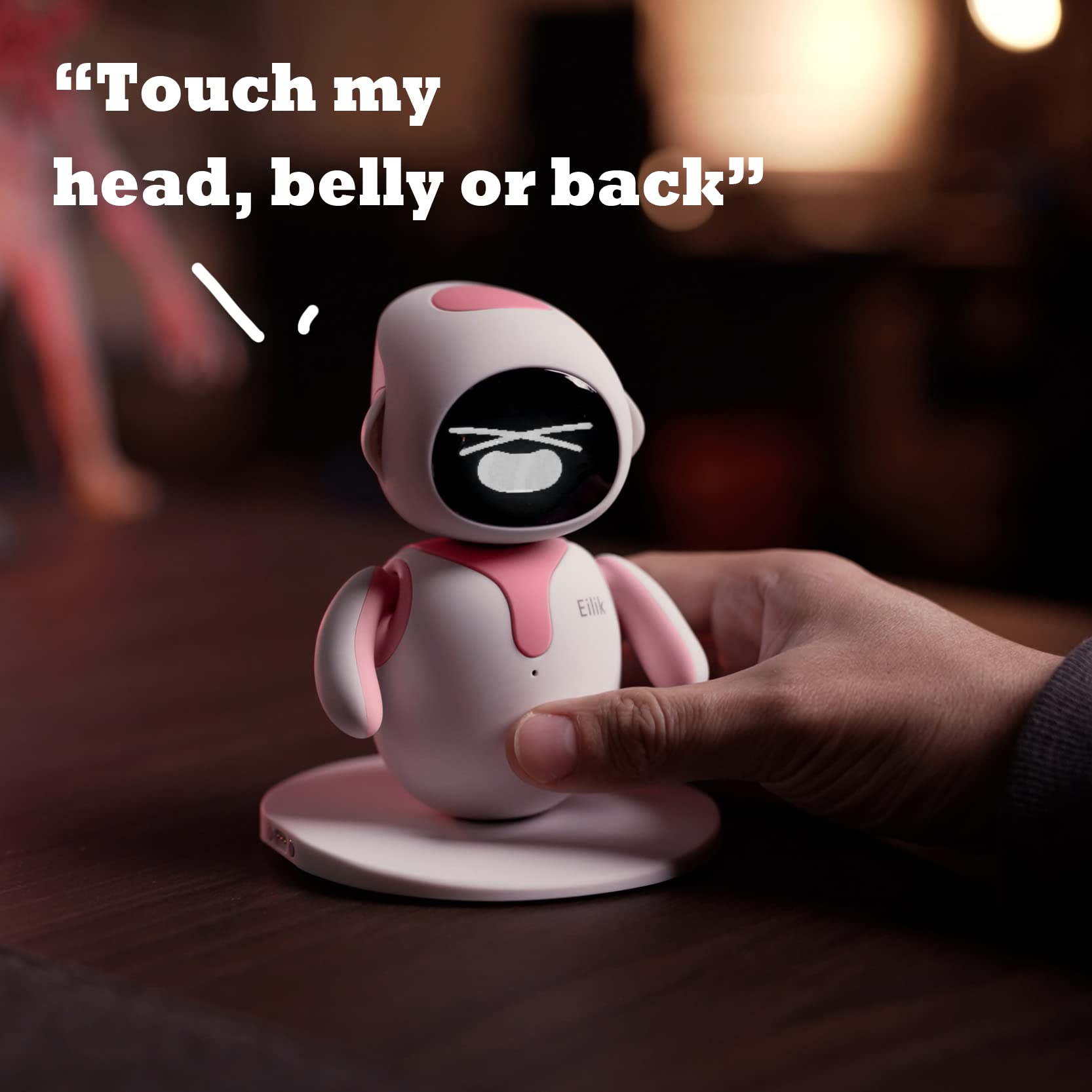 Energize Lab electronic toy pet in limited edition pink color sitting on a clean workspace desk