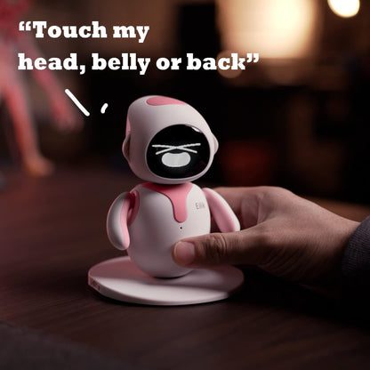 Energize Lab electronic toy pet in limited edition pink color sitting on a clean workspace desk