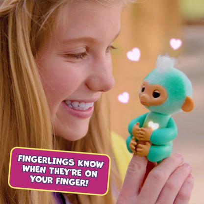 Fingerlings purple baby monkey wrapped around a finger showing touch responsive sensors