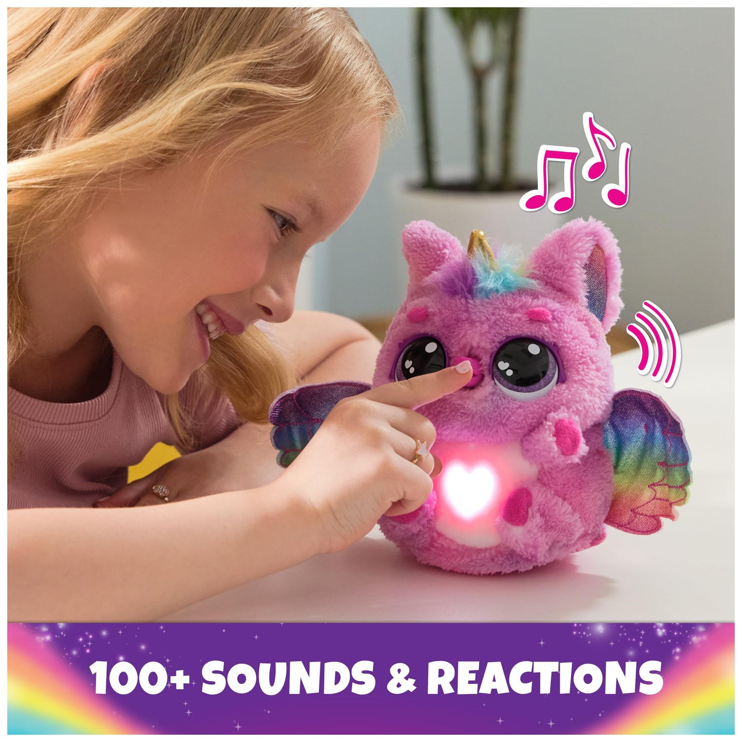Child holding the glowing Hatchimals Alive egg to demonstrate the nurturing touch and heartbeat features.