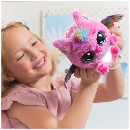 Side profile of the interactive plush unicorn toy highlighting the wing mechanism and colorful soft fabric.