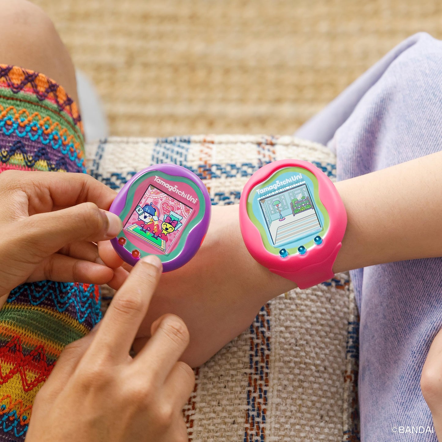 Close up of the translucent pink back panel and teal detailing on the Tamagotchi Uni shell