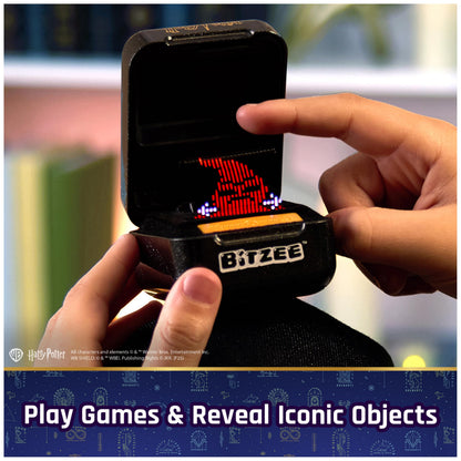 Kid playing with Bitzee digital pet to demonstrate the screen free alternative gaming method