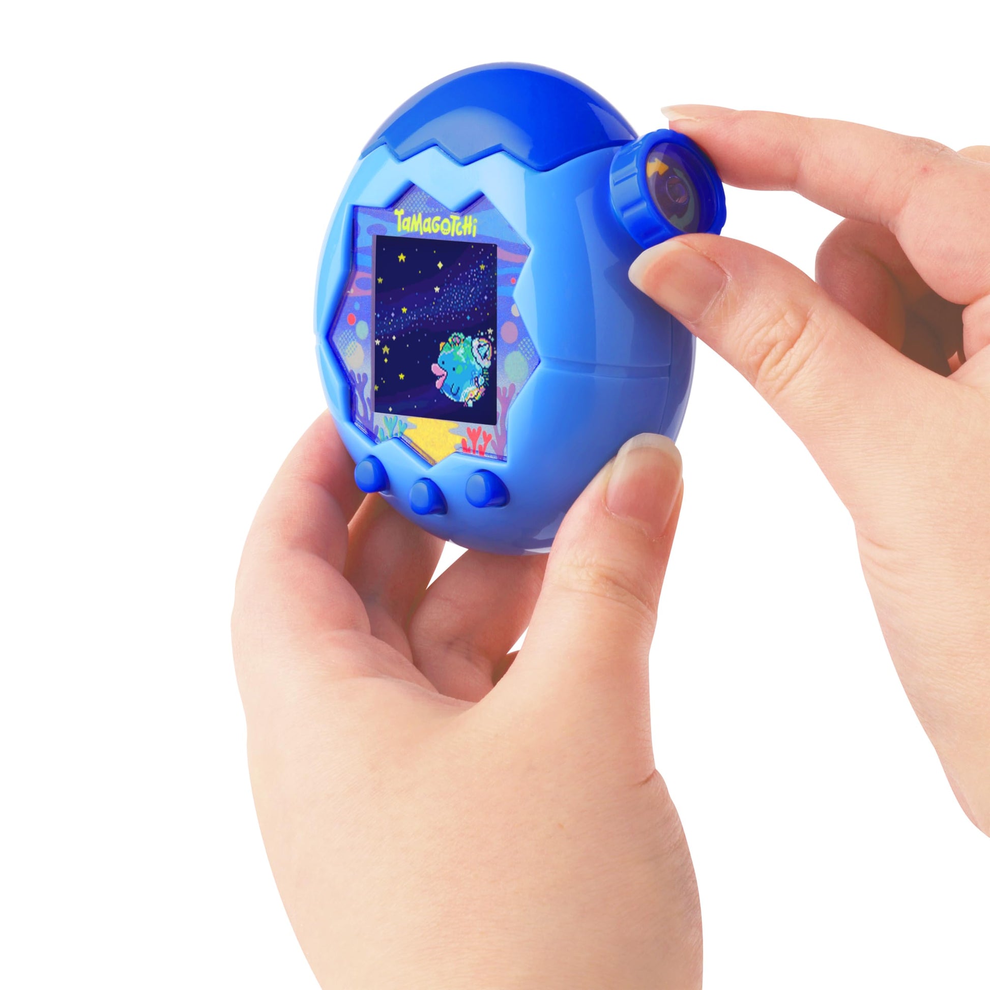 Side angle of the Tamagotchi Paradise virtual pet highlighting the physical mechanical zoom dial used for character care.