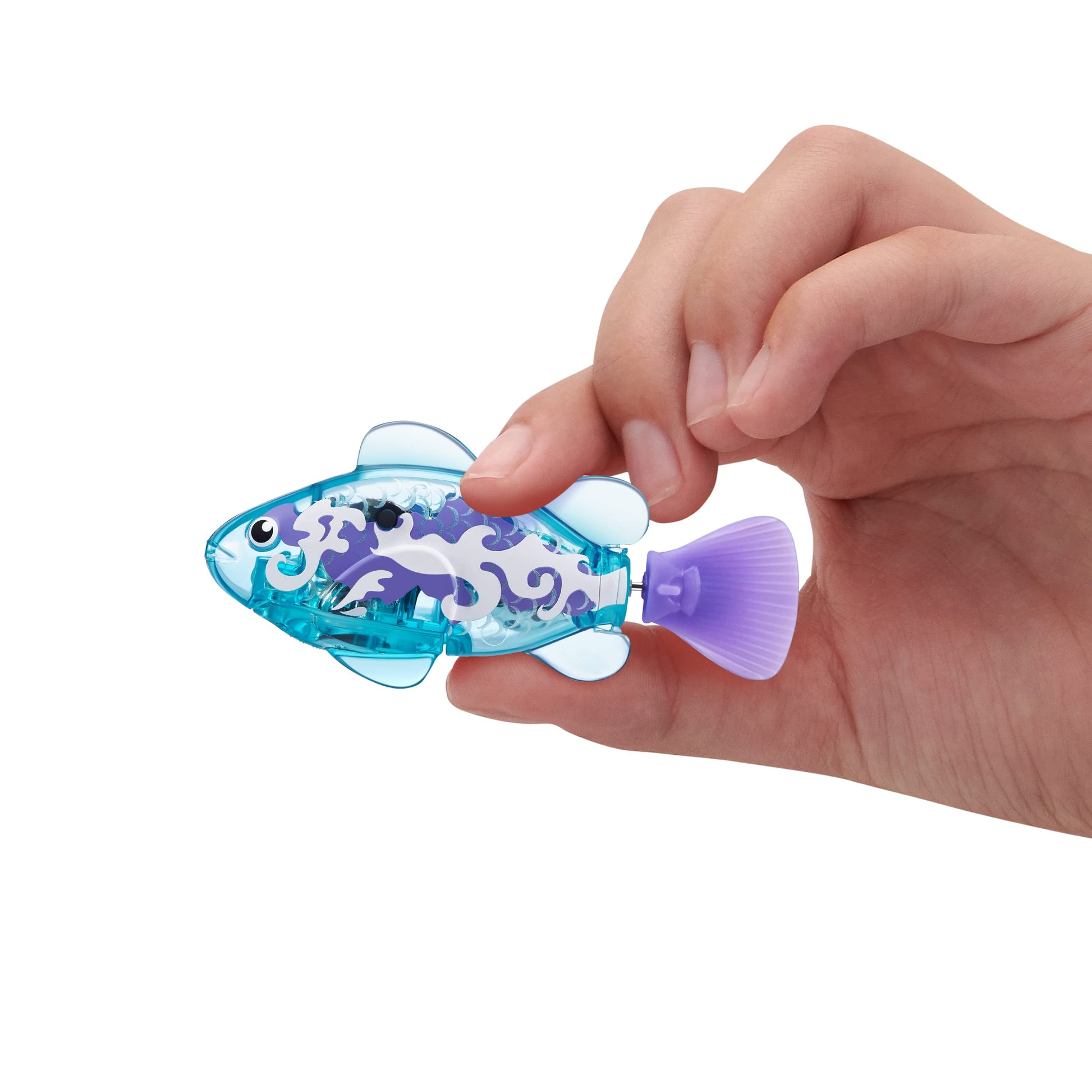 ZURU Robo Alive Series 3 water activated robotic fish swimming inside a water tank