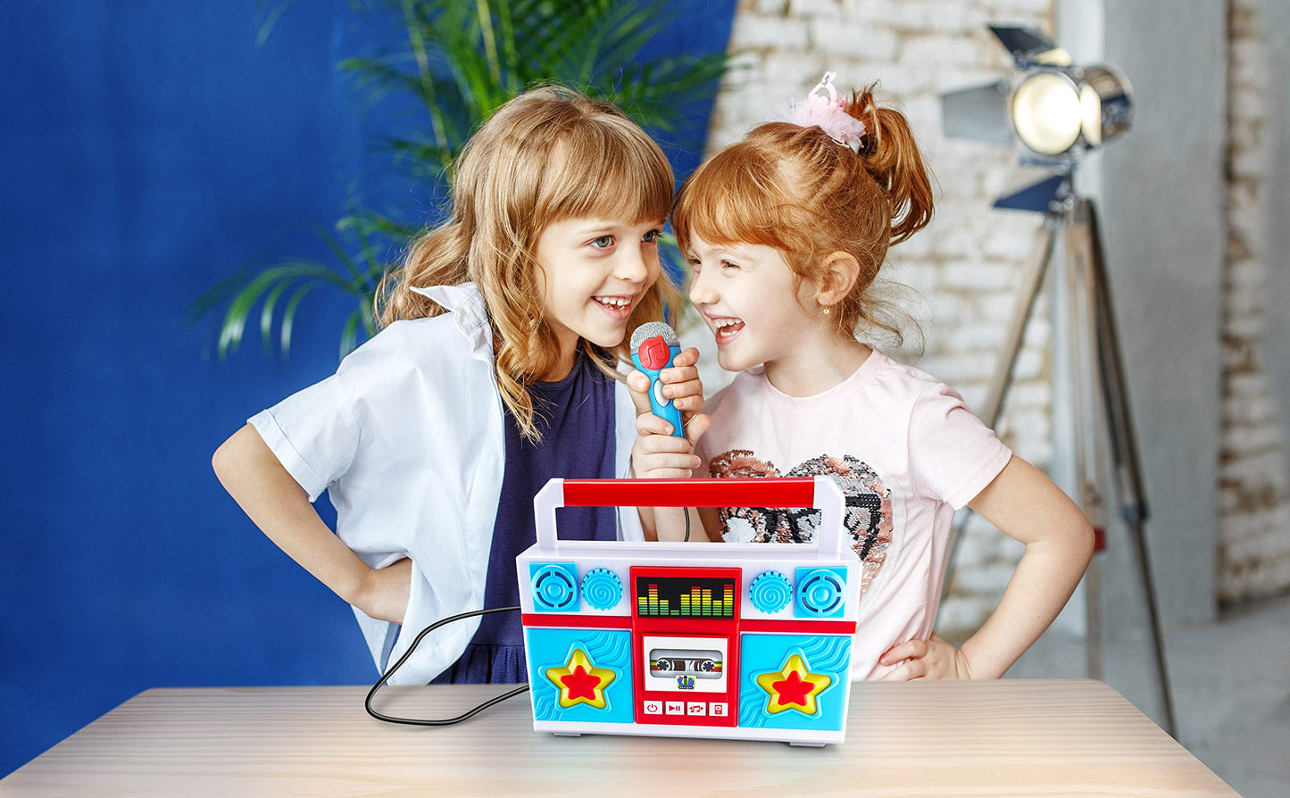 eKids toddler boombox packaging displaying the ten built in nursery rhyme titles.