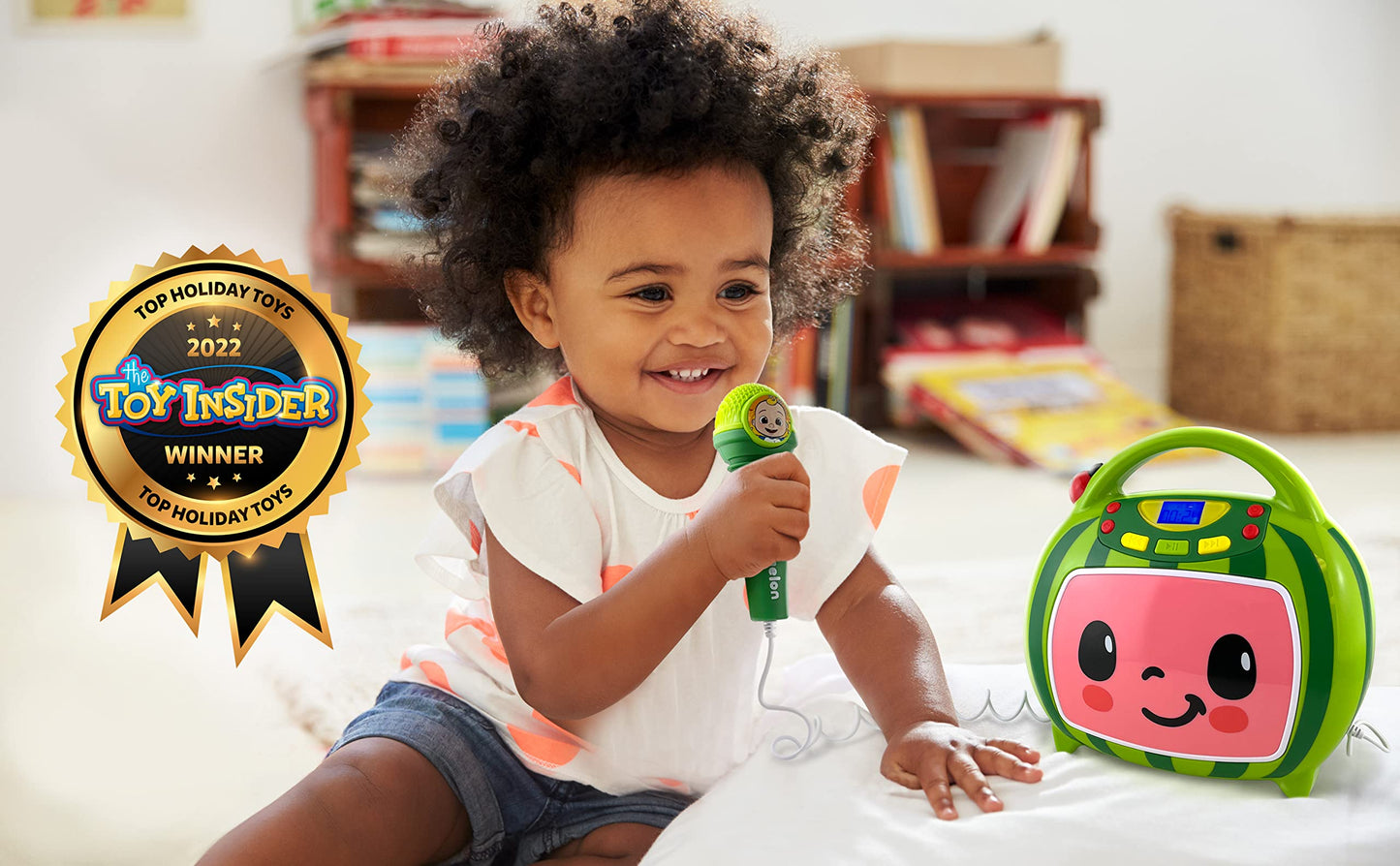 eKids portable toddler boombox displaying the working wired microphone and simple front buttons.