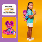 Side profile of the interactive Sesame Street karaoke machine toy demonstrating the attached wired microphone cord.