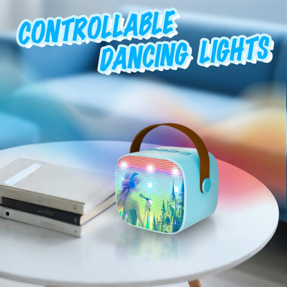 Zhipal Frozen theme karaoke speaker pulsing with colorful built in LED rhythm lights in a dark room.
