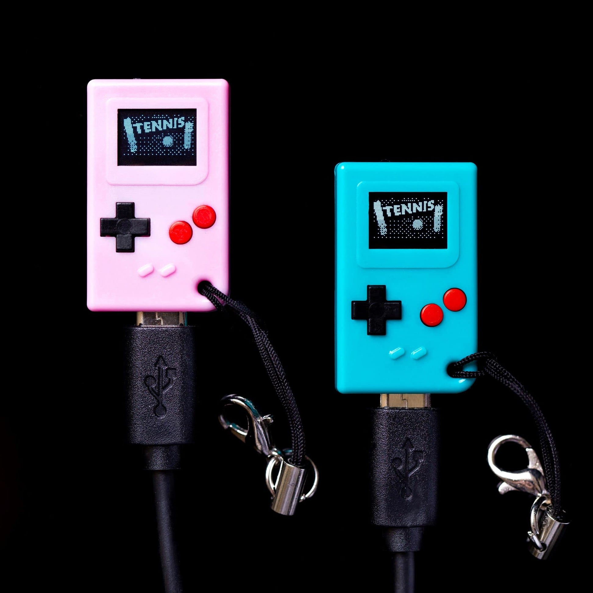Tiny retro gaming keychain console displaying a preloaded electronic game on screen