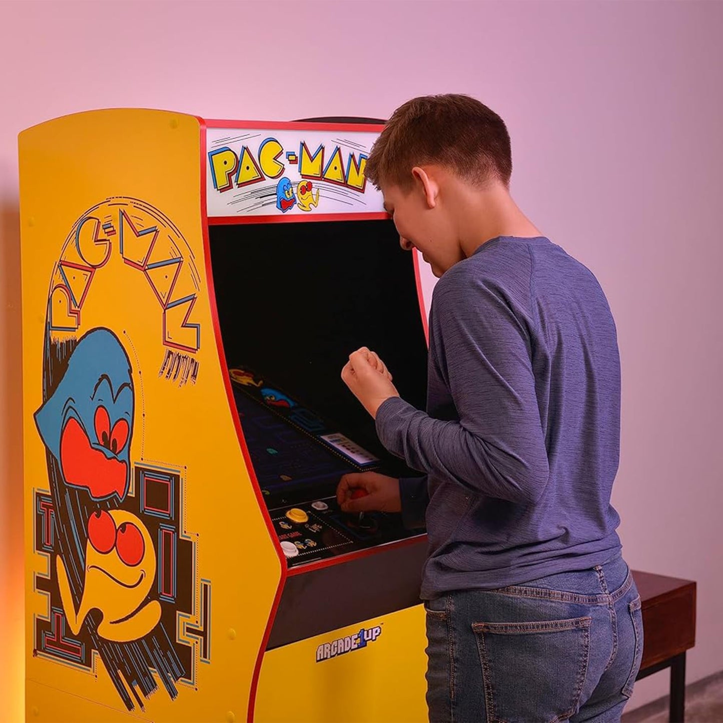 Side view of Arcade1Up Pac-Man Deluxe arcade cabinet graphics