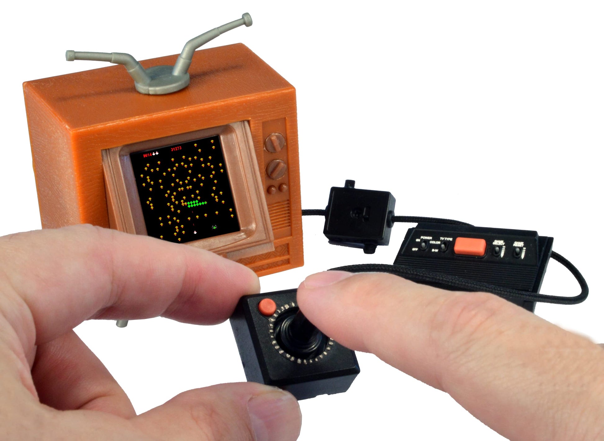 Lifestyle shot of Tiny Arcade Atari 2600 on a gaming desk
