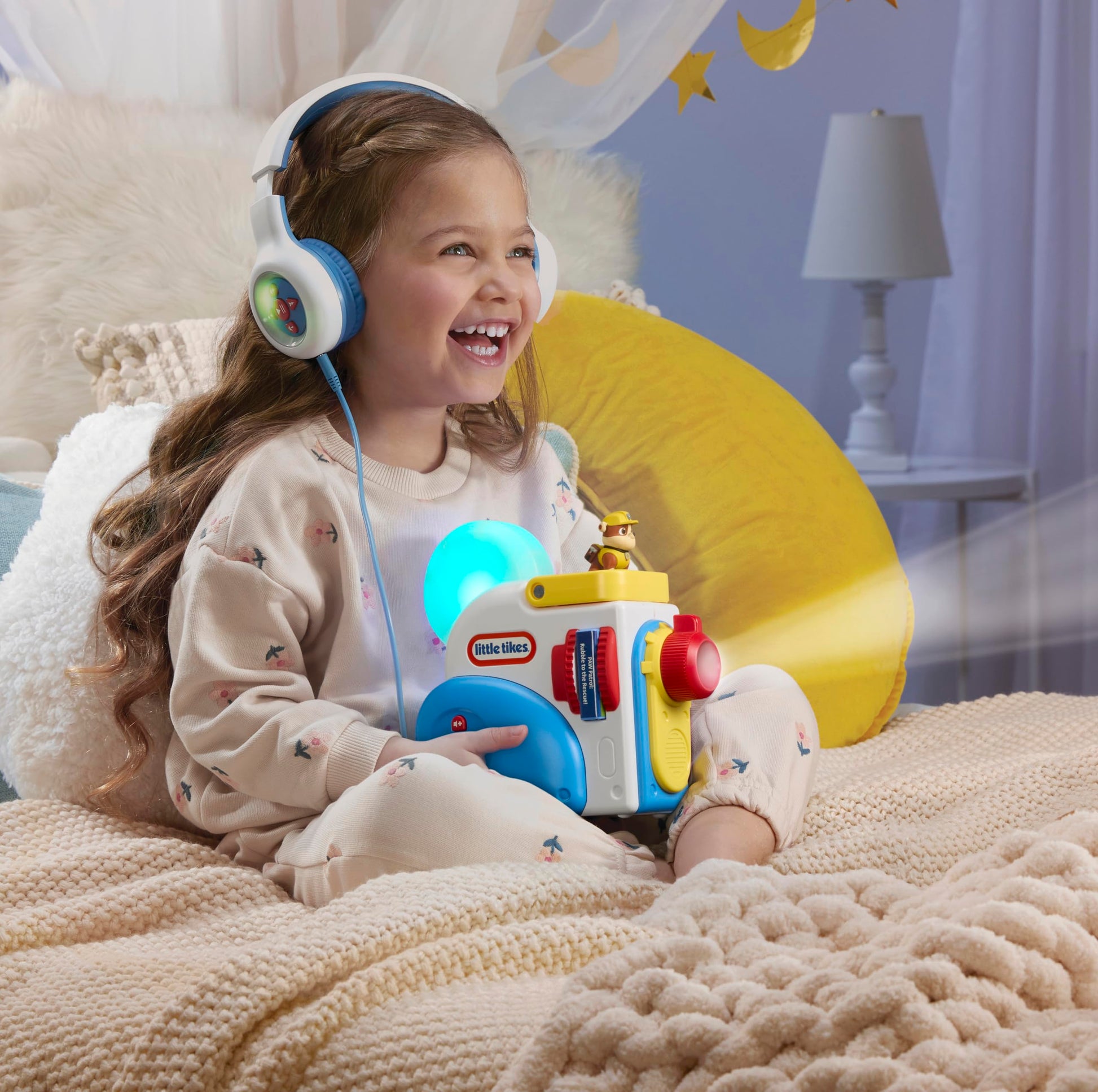 Little Tikes screen free storybook projector projecting text on a bedroom wall