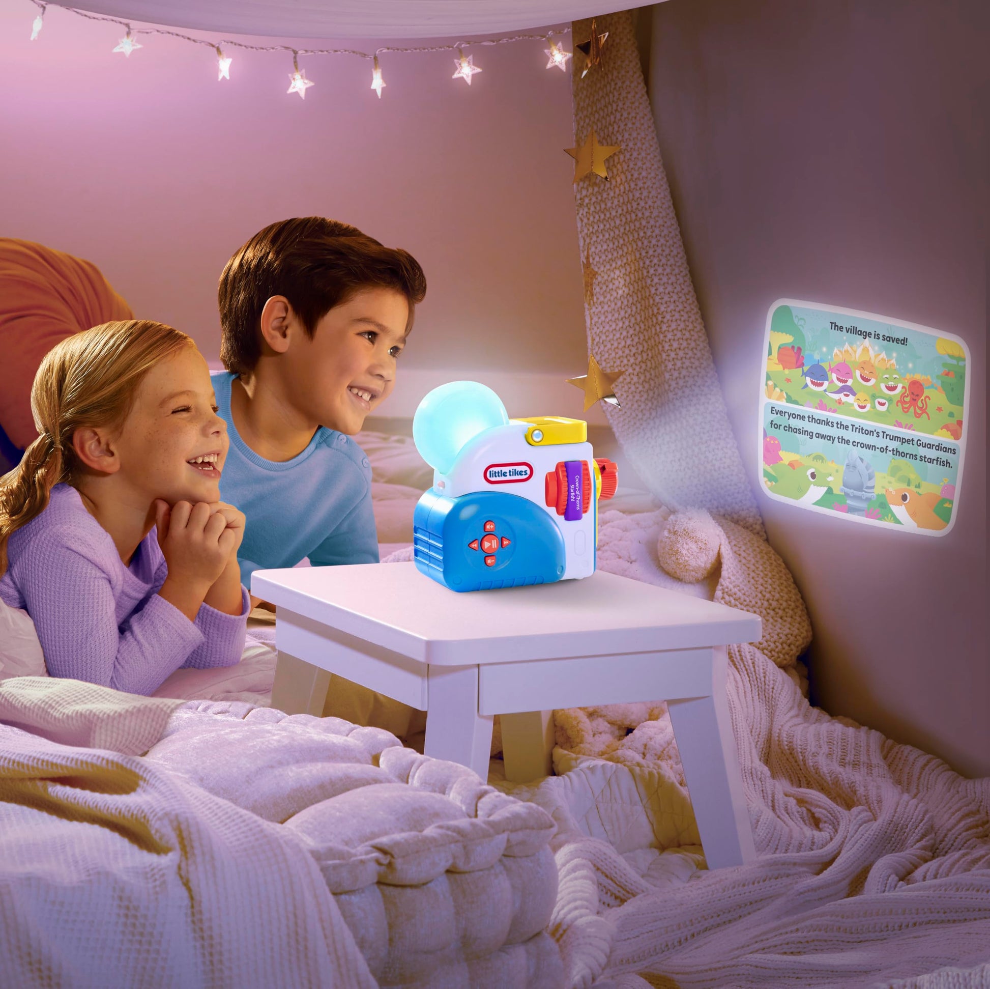 Pinkfong Baby Shark audio character toy figure sitting on top of an interactive bedtime projector console